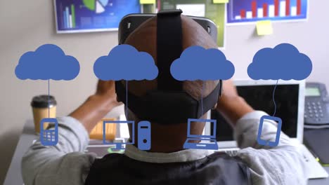 Animation-Von-Social-Media-Symbolen-über-Einem-Afroamerikanischen-Mann-Mit-VR-Headset