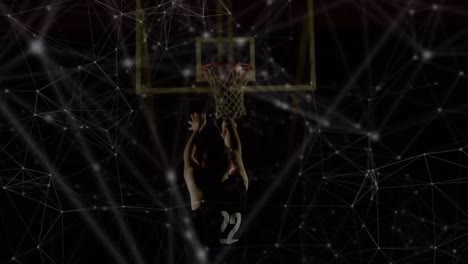 Animation-of-networks-of-connections-over-mixed-race-male-basketball-player-at-gym