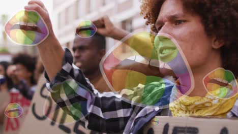 Animation-of-rainbow-lips-over-diverse-protesters-with-banners