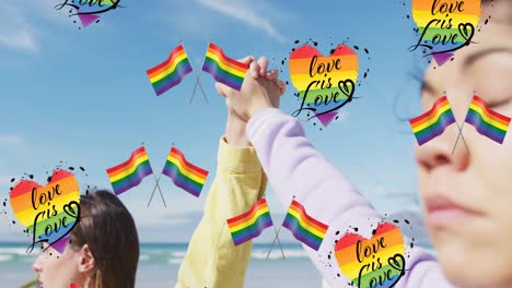 Animation-of-rainbow-flags,-heart-and-love-is-love-over-lesbian-couple-holding-hands-outdoors