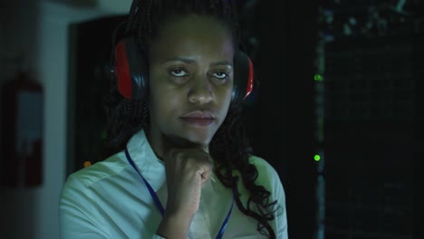 African-american-female-computer-technician-using-tablet-working-in-business-server-room