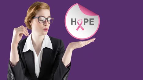 Animation-of-hope-text-with-pink-ribbon-over-young-woman