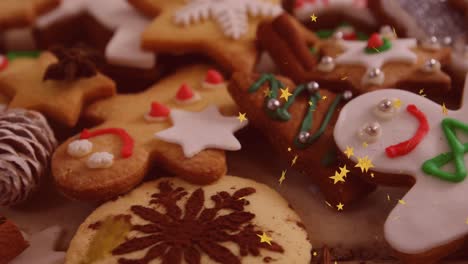 Animation-of-stars-floating-over-ginger-man-christmas-cookies