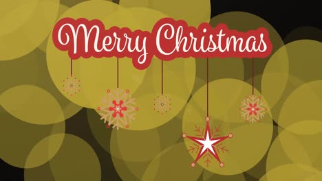 Merry-christmas-text-banner-with-hanging-decorations-against-yellow-spots-on-black-background