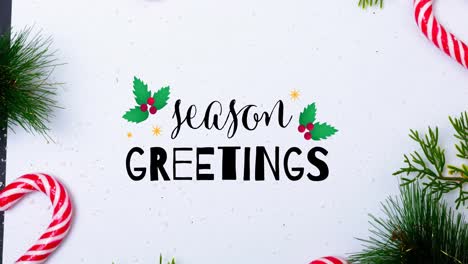 Animation-of-season-greetings-christmas-text-and-decorations-on-white-background