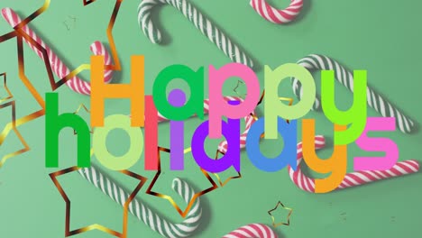 Animation-of-happy-holidays-and-christmas-decorations-over-green-background-with-candies