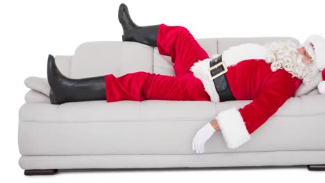 Animation-of-tired-santa-claus-resting-on-sofa-on-white-background-at-christmas-time