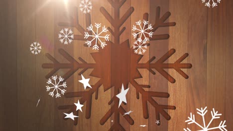 Animation-of-christmas-snowflakes-falling-over-wooden-background