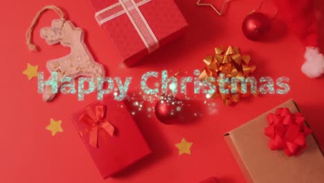 Animation-of-happy-christmas-text-over-presents,-decorations-on-red-background