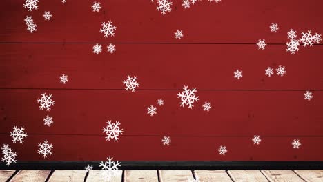 Animation-Von-Weihnachtsschneeflocken,-Die-Auf-Roten-Hintergrund-Fallen