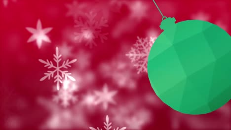 Animation-of-snow-falling-over-bauble-at-christmas