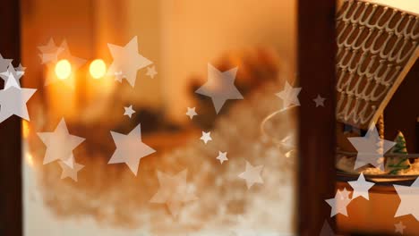 Animation-of-stars-falling-over-candles-and-window-at-christmas
