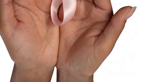Animation-of-get-checked-text-with-ribbon-logo-over-hands-of-woman-cradling-pink-cancer-ribbon