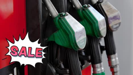 Animation-of-sale-text-in-red-over-row-of-fuel-pumps-at-petrol-station
