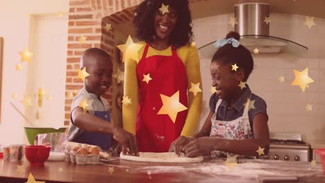 Animation-of-stars-falling-over-happy-african-american-mother-with-children-baking-at-christmas
