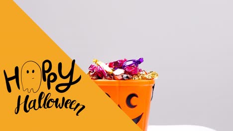 Animation-of-happy-halloween-text-over-sweets