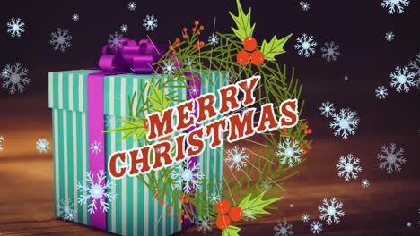 Animation-of-merry-christmas-text-over-wreath,-snow-falling-and-present