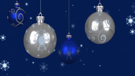 Animation-Von-Weihnachtskugeln-über-Schneeflocken-Auf-Blauem-Hintergrund