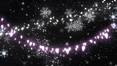 Animation-of-fairy-lights-over-snow-falling-and-light-spots-on-black-background-at-christmas