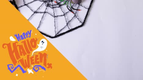 Animation-of-happy-halloween-text-over-web