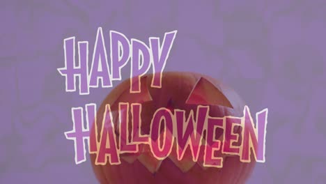 Animation-of-happy-halloween-text-over-carved-pumpkin