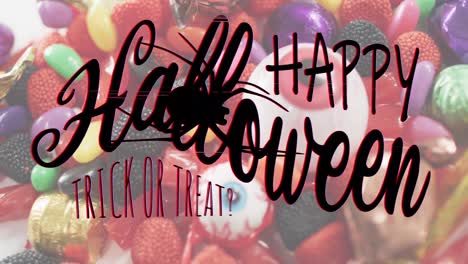 Animation-of-happy-halloween-text-over-trick-or-treat-sweets