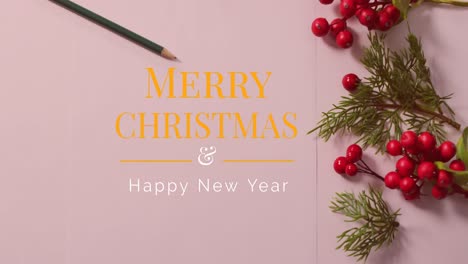 Animation-of-merry-christmas-text-over-pencil