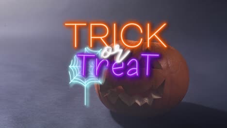 Animation-of-trick-or-treat-text-over-pumpkin