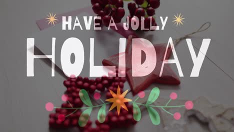 Animation-of-have-a-jolly-holidaytext-over-christmas-decorations