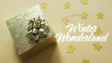 Animation-of-winter-wonderland-text-over-christmas-gift