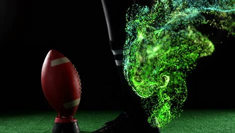 Animation-of-glowing-green-particles-moving-over-rugby-player-kicking-ball