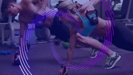 Animation-of-purple-line-spiral-rotating-over-man-and-woman-exercising-at-gym