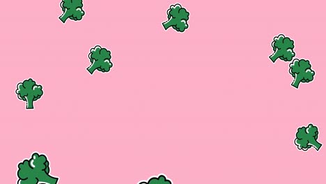 Animation-of-green-broccoli-falling-on-pale-pink-background