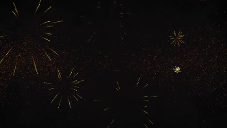 Animation-of-new-year's-eve-greetings-and-yellow-fireworks-exploding-on-black-background