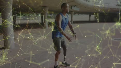 Animation-of-yellow-communication-network-over-male-athlete-with-prosthetic-leg-exercising-outdoors