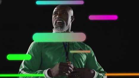 Animation-of-colourful-shapes-over-african-american-sports-coach-checking-stopwatch