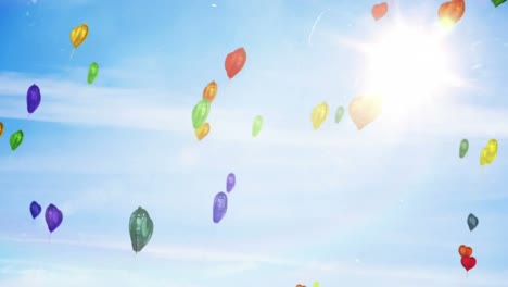 Animation-of-multiple-love-heart-balloons-on-blue-sky-background