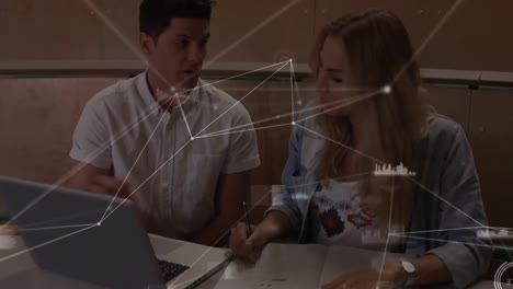 Animation-of-network-of-connections-over-students-with-laptop