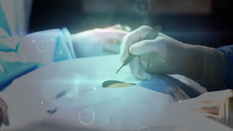 Animation-of-network-of-connections-over-surgeon-in-surgical-glove-operating-with-scalpe