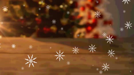 Animation-Fallender-Schneeflocken-über-Tisch-Und-Bokeh-Weihnachtsbaumhintergrund