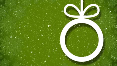 Animation-of-snowflakes-falling-over-white-christmas-bauble-outline-on-green-background