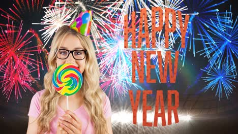 Animation-of-happy-blonde-haired-woman-celebrating,-over-happy-new-year-text-and-colourful-fireworks