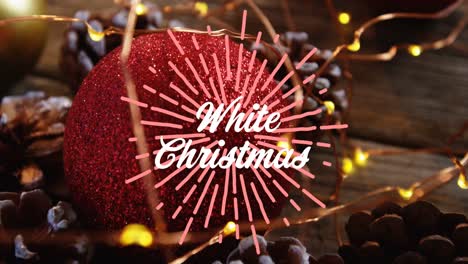 Animation-of-white-christmas-text-over-christmas-decorations