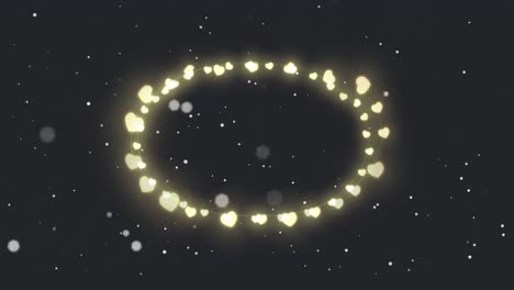 Animation-of-circle-of-glowing-heart-christmas-fairy-lights-over-falling-snow,-on-black