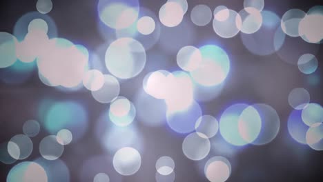 Animation-of-blue-and-white-bokeh-christmas-lights-over-smoke-on-black-background