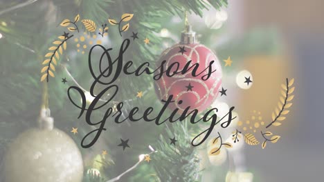 Animation-of-seasons-greetings-text-over-christmas-tree