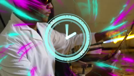 Animation-of-clock-moving-over-african-american-male-scientist-working-in-lab
