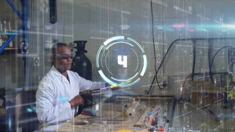 Animation-of-scope-scanning-over-african-american-male-scientist-working-in-lab