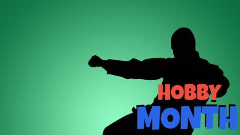 Animation-of-hobby-month-text-in-red-and-blue-with-silhouette-of-martial-artist-in-action-on-green