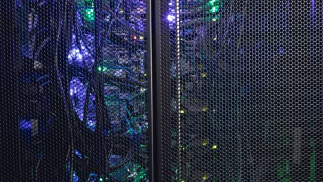 Video-of-close-up-of-purple-and-green-lights-in-computer-server